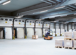 The forklifts in the Logistics and Distribution Center fill truck containers during the day and train containers at night. (photo)