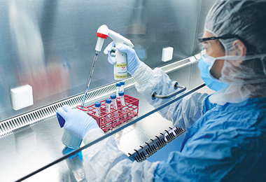 Scientist controls a vaccine sample (Photo)